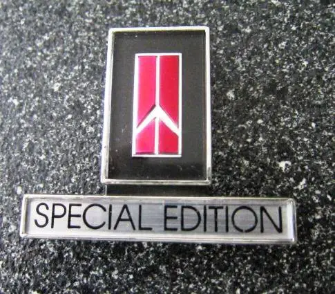 84 Olds Special Edition Dash Emblem 1.JPG